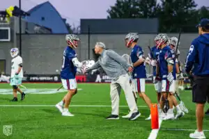 Coach Holman keeps the energy high from the sidelines (Photo courtesy of Nick Ieradi).