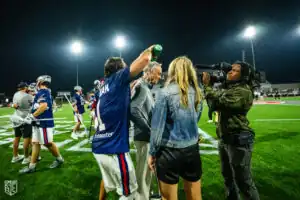 Marcus Holman gives his dad and coach a celebratory gatorade shower (Photo courtesy of Nick Ieradi).