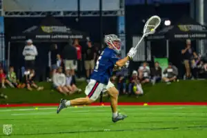 Colin Kirst runs the ball out of the net (Photo courtesy of Nick Ieradi).