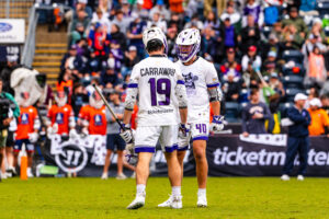 Connor Kelly hyped up Carraway after he sinked a vital two-pointer (Photo courtesy of Nick Ieradi). 