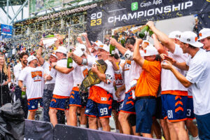 The new champs are crowned in a champagne shower (Photo courtesy of Nick Ieradi).
